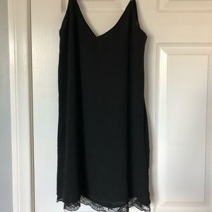 Black slip dress with lace detail